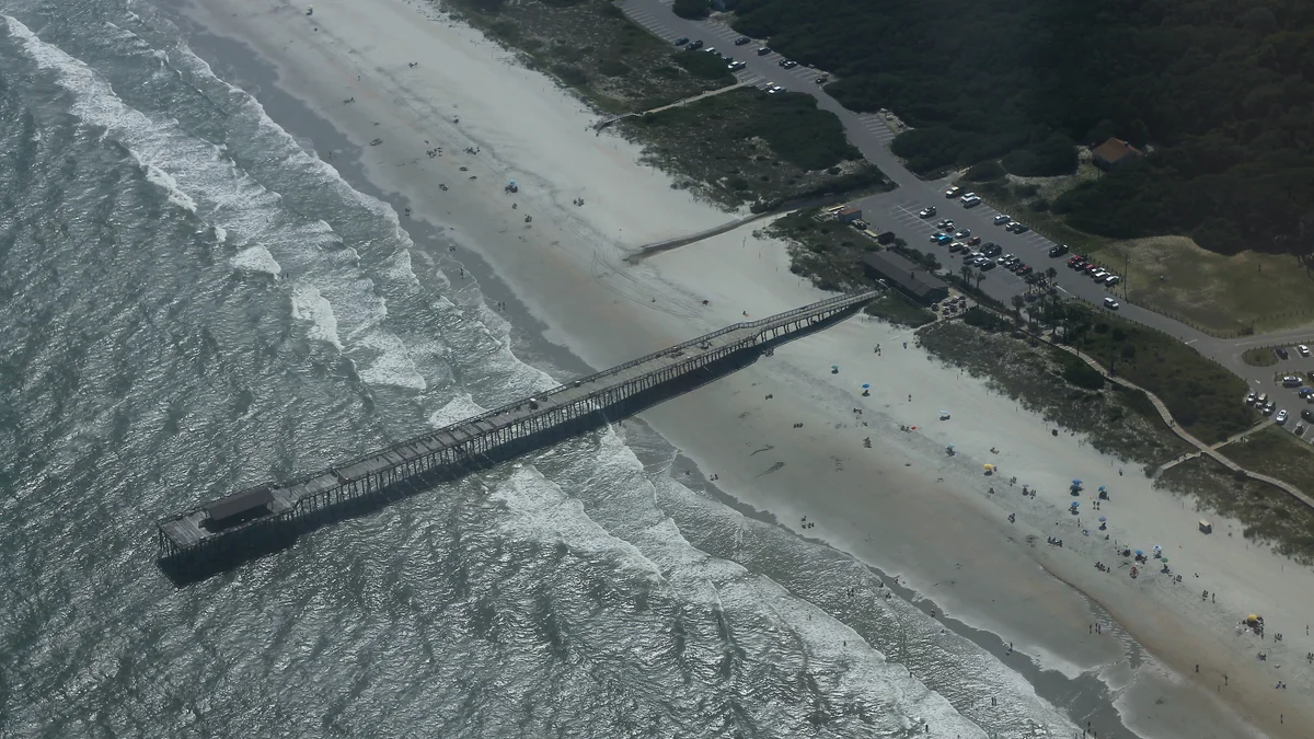 Aerial view of the Myrtle Beach State Park pier and coastline.